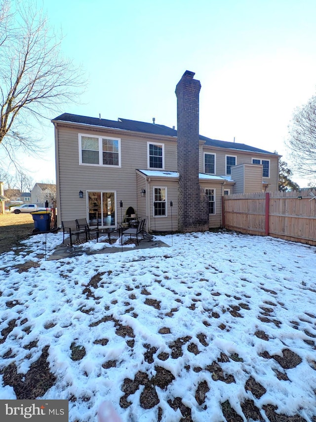 view of snow covered house