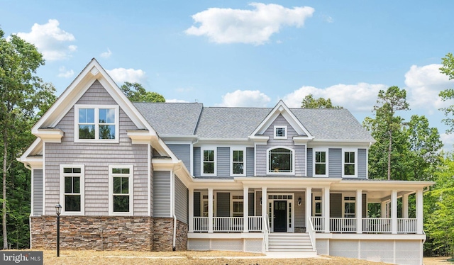 craftsman inspired home featuring covered porch