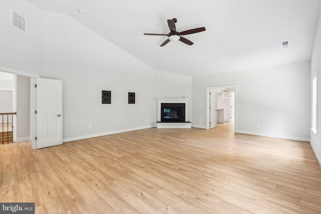 unfurnished living room with ceiling fan, light hardwood / wood-style floors, and lofted ceiling