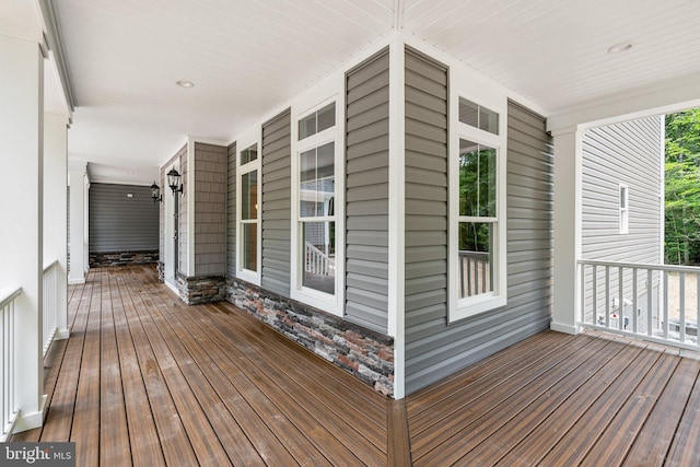 wooden terrace with a porch