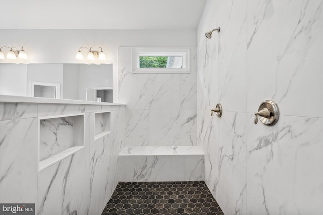 bathroom with a tile shower