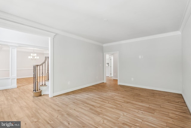 empty room with light hardwood / wood-style flooring, crown molding, and an inviting chandelier