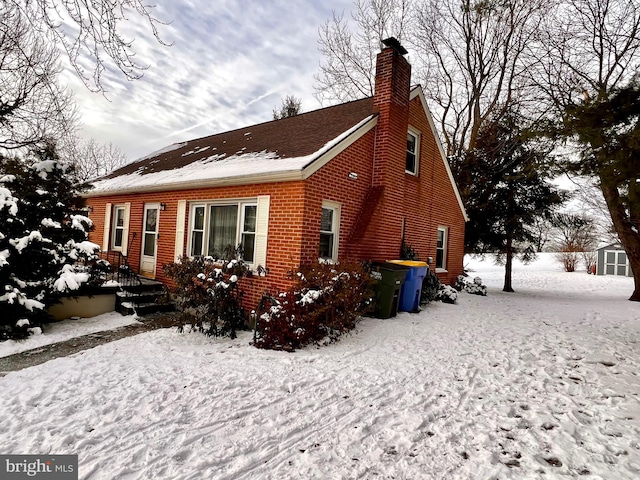 view of snow covered house