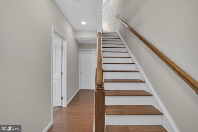 staircase featuring hardwood / wood-style flooring