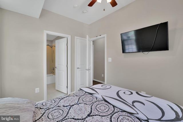 bedroom with ceiling fan and ensuite bath