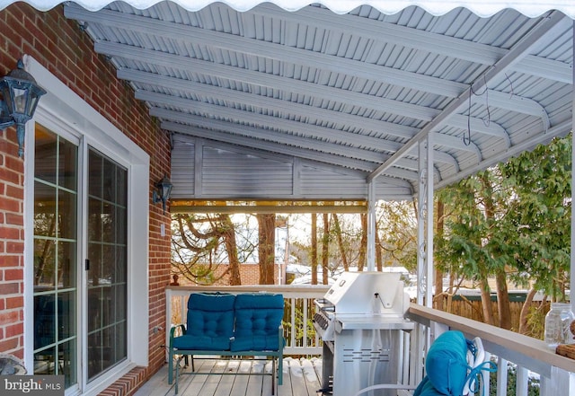 wooden terrace with a grill