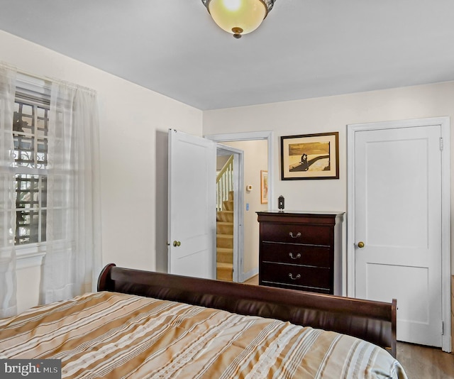 bedroom with hardwood / wood-style floors