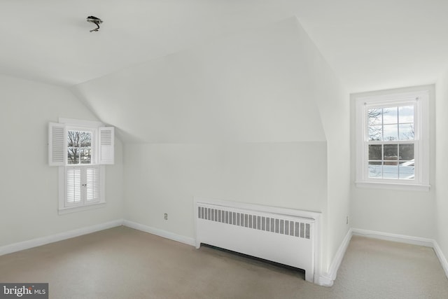 bonus room with carpet, radiator, and lofted ceiling