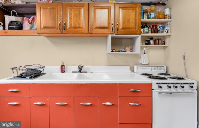 kitchen featuring white range with electric cooktop and sink