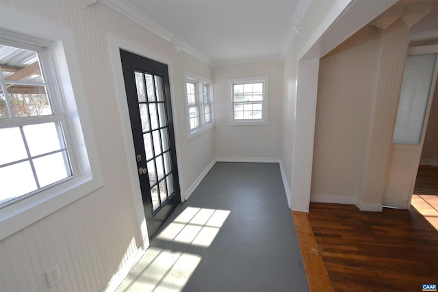 entryway with dark wood-type flooring and ornamental molding