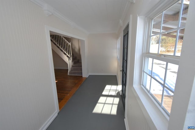 hall featuring dark hardwood / wood-style flooring and crown molding