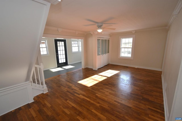 empty room with ceiling fan, ornamental molding, and dark hardwood / wood-style flooring