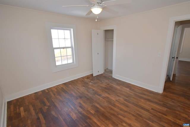 unfurnished bedroom featuring ceiling fan, dark hardwood / wood-style floors, a closet, and ornamental molding