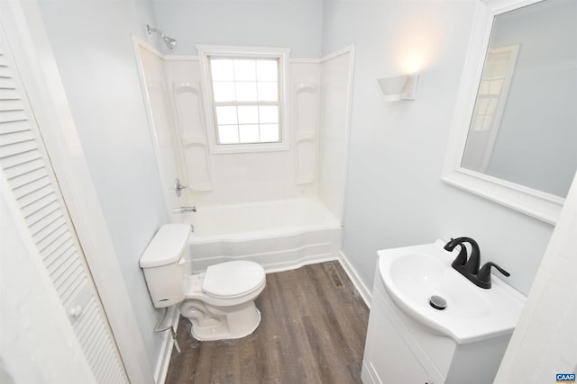 full bathroom featuring hardwood / wood-style flooring, shower / bathing tub combination, toilet, and vanity