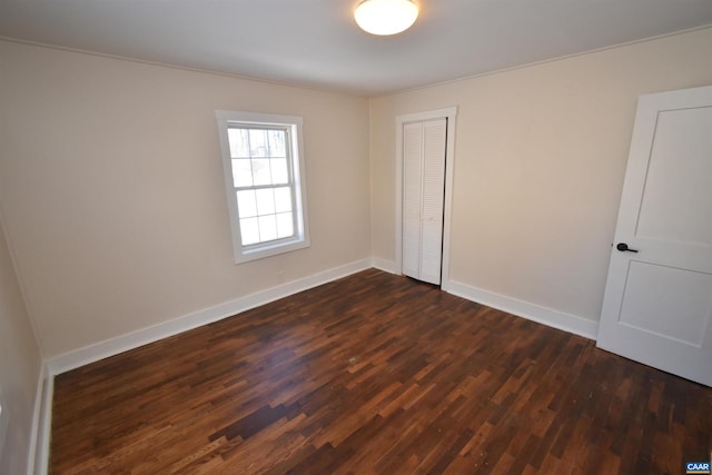 spare room featuring dark hardwood / wood-style floors