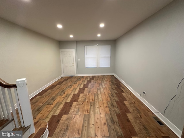 spare room featuring dark hardwood / wood-style floors