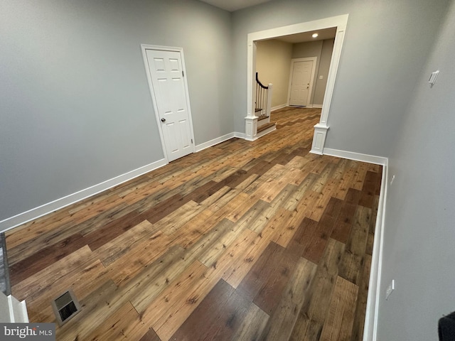 empty room featuring wood-type flooring