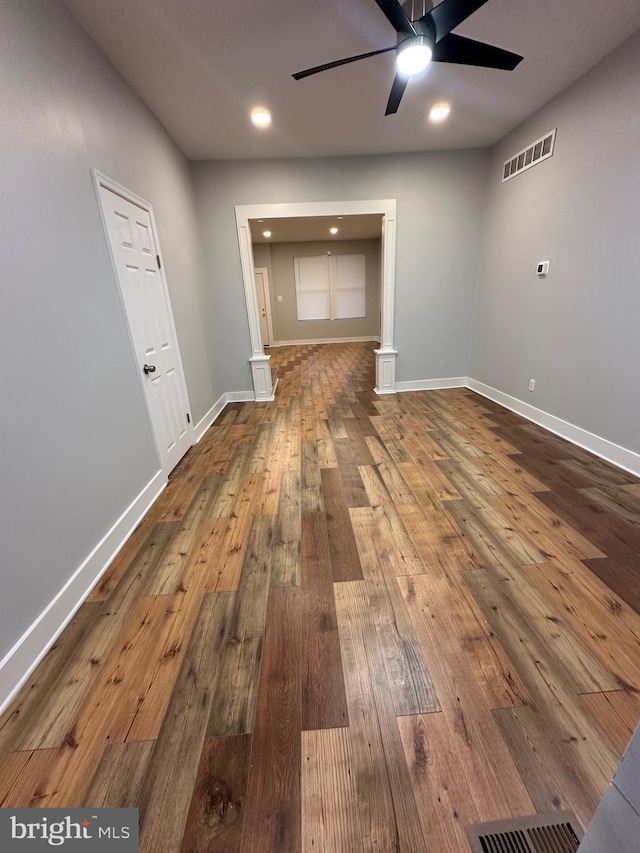 interior space featuring hardwood / wood-style floors and ceiling fan