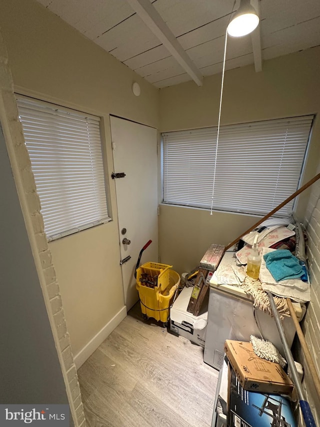 interior space featuring hardwood / wood-style floors and wooden ceiling