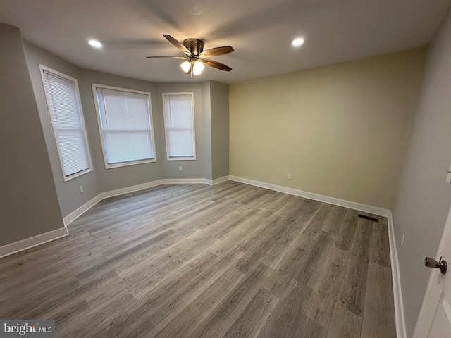 unfurnished room featuring ceiling fan and hardwood / wood-style floors