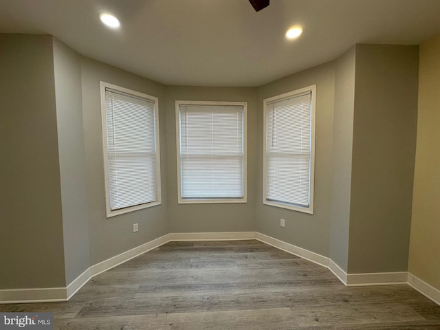 spare room with light hardwood / wood-style flooring