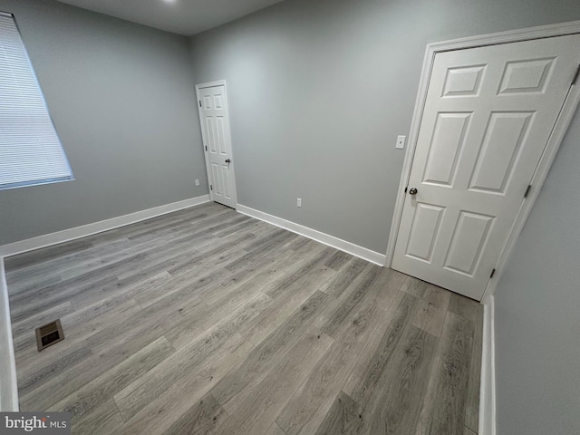 unfurnished room featuring light hardwood / wood-style floors