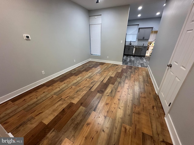 interior space featuring sink and dark wood-type flooring