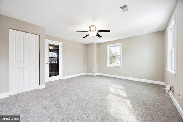 unfurnished room featuring carpet flooring and ceiling fan