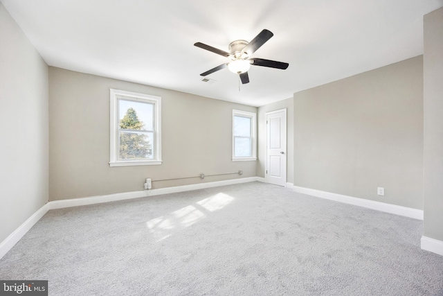 carpeted empty room with ceiling fan