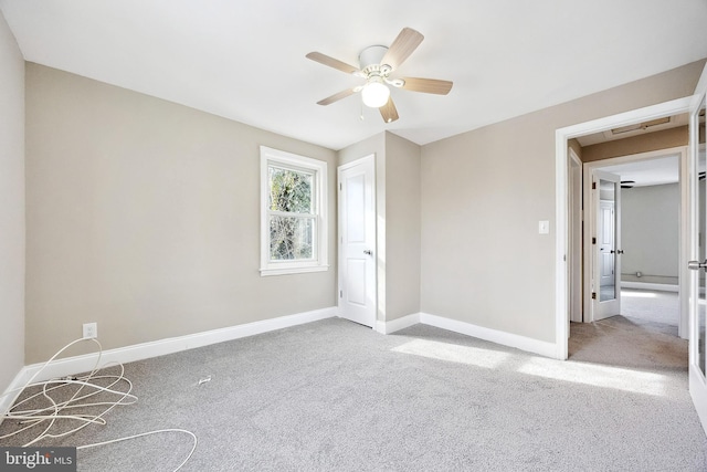 unfurnished bedroom featuring ceiling fan and light carpet