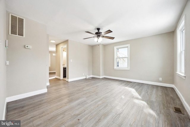 unfurnished room with light hardwood / wood-style floors and ceiling fan