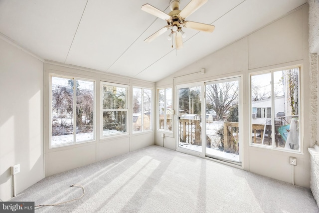 unfurnished sunroom with ceiling fan and vaulted ceiling