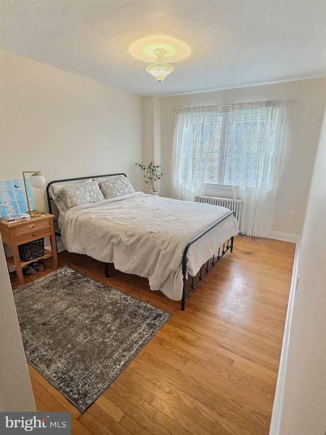 bedroom with light wood-type flooring