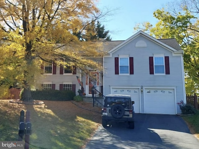 view of front of property with a garage