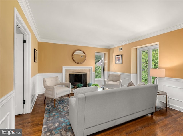 living room with ornamental molding and dark wood-type flooring