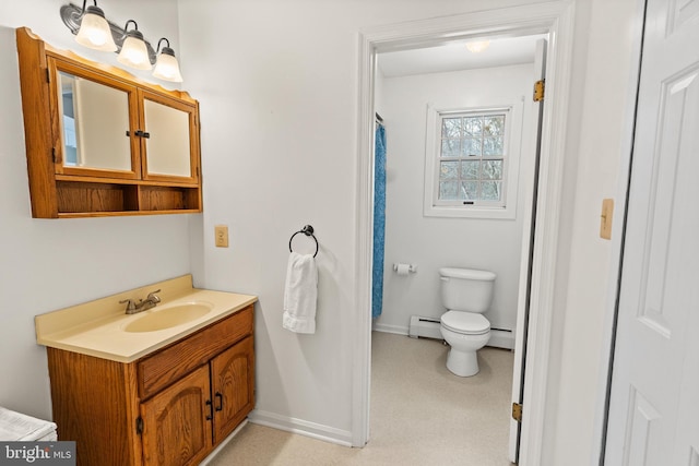 bathroom with baseboard heating, vanity, and toilet