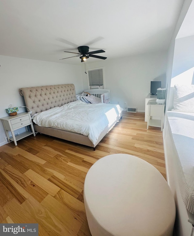 bedroom featuring ceiling fan and light hardwood / wood-style flooring