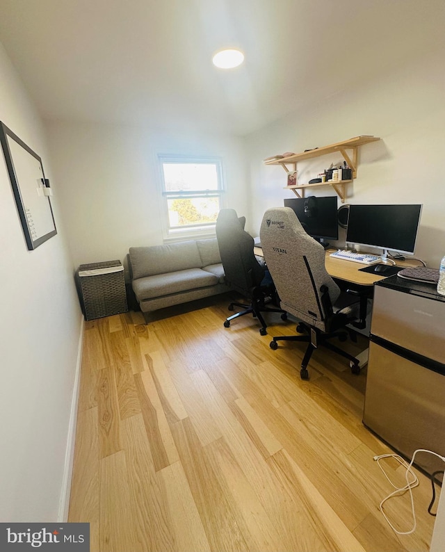 home office featuring hardwood / wood-style floors