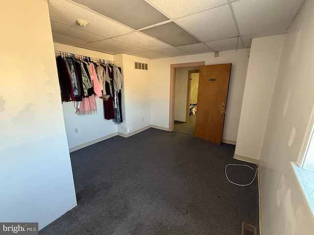 spare room with a paneled ceiling