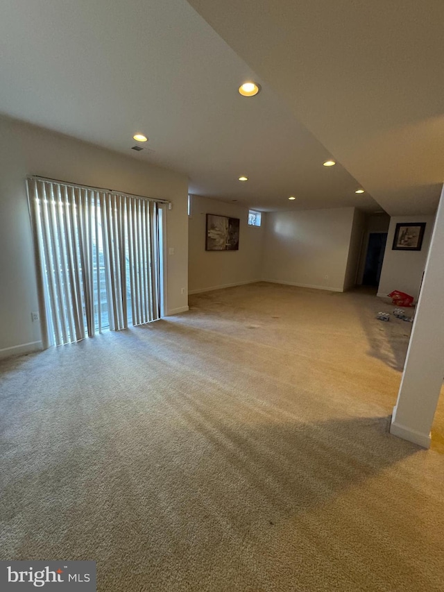 interior space featuring recessed lighting, baseboards, and carpet