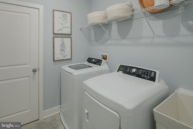 washroom featuring sink and independent washer and dryer