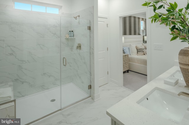 bathroom with vanity and a shower with shower door