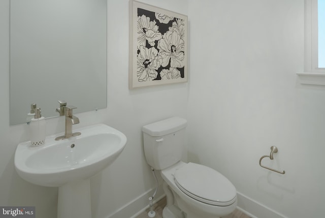 bathroom featuring sink and toilet