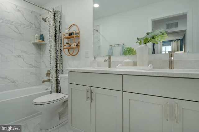 full bathroom featuring shower / tub combo with curtain, vanity, and toilet