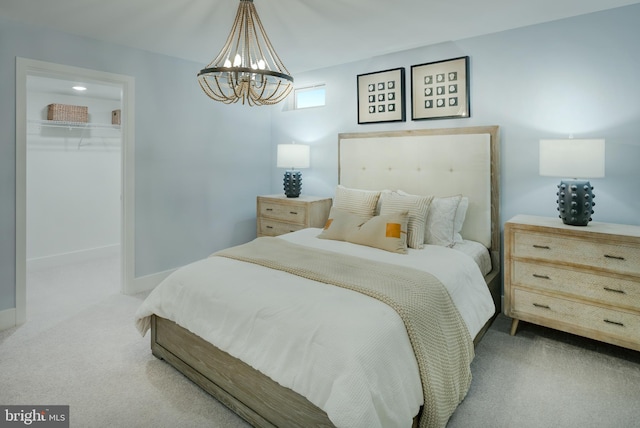 bedroom featuring carpet floors and an inviting chandelier