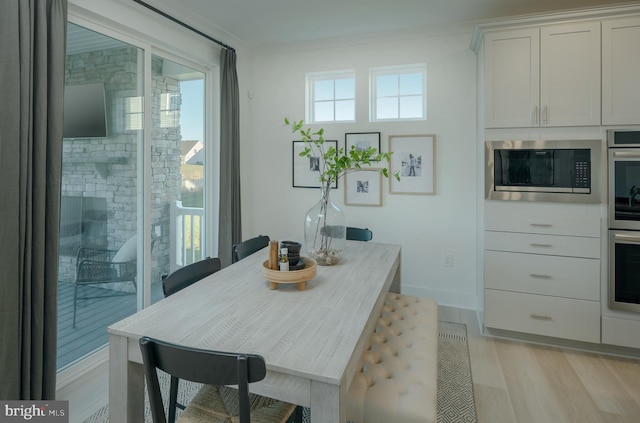 dining area with light hardwood / wood-style flooring