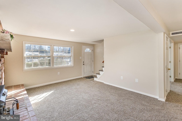 unfurnished living room with carpet