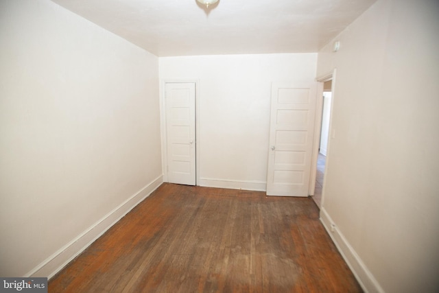 hallway featuring dark wood-type flooring