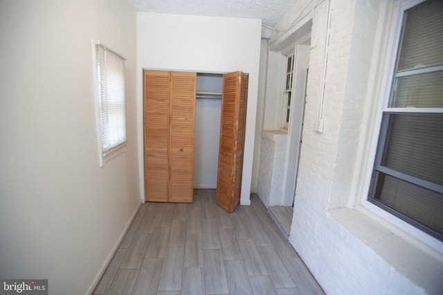 hallway featuring a textured ceiling