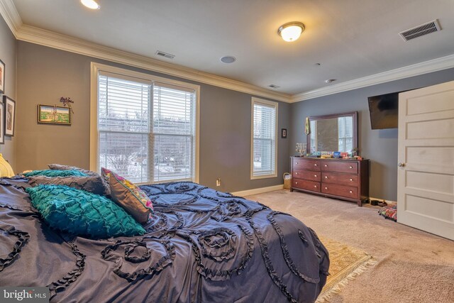 carpeted bedroom with ornamental molding